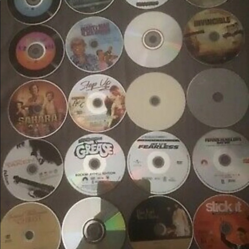 Bundle of 25 DVD's. Assorted Titles! In a "Case Logic" case for protections.
